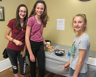 Neighbors | Alexis Bartolomucci.Girls at the Hogwarts Summer School program on June 21 at the Poland library made their own slime using household ingredients.