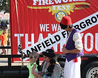 Makenna Smith(3) of Cortland meets Jasmine and Aladin during the Canfield Rotary Fireworks Fest at the Canfield Fair Grounds, Saturday, July 1, 2017 in Canfield...(Nikos Frazier | The Vindicator)