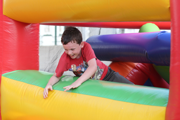 Nathan Porter(7) of Boardman jumps through the 61 ft obstacle bounce house during the Canfield Rotary Fireworks Fest at the Canfield Fair Grounds, Saturday, July 1, 2017 in Canfield...(Nikos Frazier | The Vindicator)