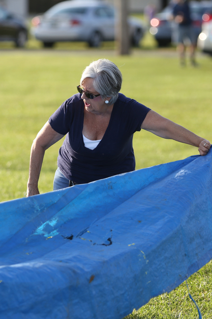Gayla Spellman of Canfield lays out her tarp before the fireworks during the Canfield Rotary Fireworks Fest at the Canfield Fair Grounds, Saturday, July 1, 2017 in Canfield...(Nikos Frazier | The Vindicator)