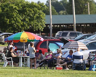 Families wait in lawn chairs before the fireworks during the Canfield Rotary Fireworks Fest at the Canfield Fair Grounds, Saturday, July 1, 2017 in Canfield...(Nikos Frazier | The Vindicator)