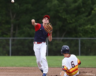 SBA Aces second baseman Matt Costello (22) throws to first after outing Astro Falcons runner Mike Turconi (6) during the 1st inning as Astro Falcons takes on SBA Aces, Saturday, July 1, 2017 at Bob Cene Park. Astros won 6-0...(Nikos Frazier | The Vindicator)..