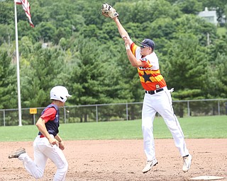 Astro Falcons first baseman Joe Rock(5) jumps up to out SBA Aces runner Anthony Coiffi (2) during the 6th inning as Astro Falcons takes on SBA Aces, Saturday, July 1, 2017 at Bob Cene Park. Astros won 6-0...(Nikos Frazier | The Vindicator).