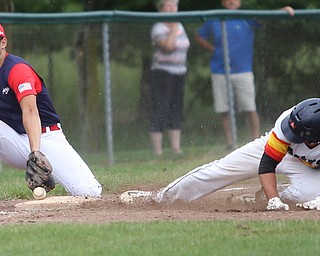 Astro Falcons runner Matt Gibson (24) slides into third as SBA Aces third baseman Sam Wells (21) waits for the pass during the 7th inning as Astro Falcons takes on SBA Aces, Saturday, July 1, 2017 at Bob Cene Park. Astros won 6-0...(Nikos Frazier | The Vindicator).