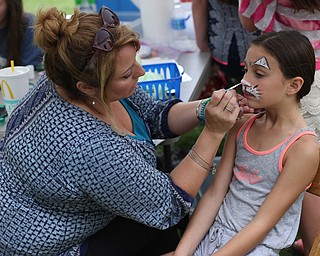 Isabel Greco(8) of Poland has her face painted by Vonda Keeler of Poland Village Baptist Church during the 11th annual Celebrate Poland weekend at Village Hall, Saturday, July 1, 2017 in Poland...(Nikos Frazier | The Vindicator)