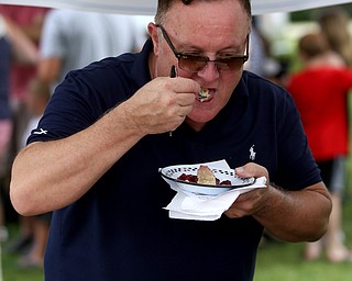 Judge and Chef David Armstrong samples a cherry pie during the cherry pie baking contest during the 11th annual Celebrate Poland weekend at Village Hall, Saturday, July 1, 2017 in Poland...(Nikos Frazier | The Vindicator)