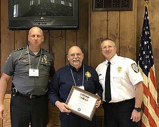 Hermitage Fire Chief John Flynn and Hermitage Police Chief Eric Jewell presented the Legion of Honor Award from the Chapel of Four Chaplains to William Lotz of West Richland, Wash., recently while he was attending Hermitage’s ninth annual training seminar. The award is presented to those who have given a lifetime or career of outstanding humanitarian service which has affected the quality of life in one’s community or nation. Above from left are Jewell, Lotz and Flynn.