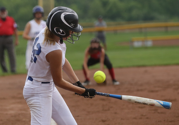Poland batter Maria Fire(12) swings during the 1st inning as Canfield takes on Poland in the 12u Little League district title, Monday, July 3, 2017 at Fields of Dreams in Boardman. Poland won 7-6...(Nikos Frazier | The Vindicator)..
