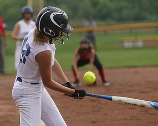 Poland batter Maria Fire(12) swings during the 1st inning as Canfield takes on Poland in the 12u Little League district title, Monday, July 3, 2017 at Fields of Dreams in Boardman. Poland won 7-6...(Nikos Frazier | The Vindicator)..