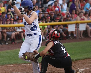 Poland runner Alaina Scavina(40) is tagged out by Canfield catcher Layni Bednar(9) during the 1st inning as Canfield takes on Poland in the 12u Little League district title, Monday, July 3, 2017 at Fields of Dreams in Boardman. Poland won 7-6...(Nikos Frazier | The Vindicator)..
