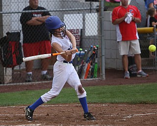 Poland batter Emily Denney(10) swings during the 2nd inning as Canfield takes on Poland in the 12u Little League district title, Monday, July 3, 2017 at Fields of Dreams in Boardman. Poland won 7-6...(Nikos Frazier | The Vindicator)..