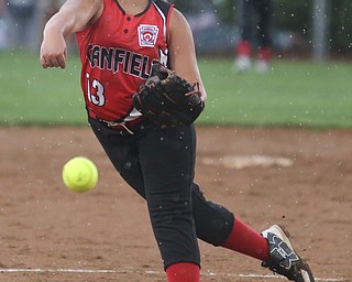 Canfield pitcher Mia Opalick(13) pitches during the 3rd inning as Canfield takes on Poland in the 12u Little League district title, Monday, July 3, 2017 at Fields of Dreams in Boardman. Poland won 7-6...(Nikos Frazier | The Vindicator)..