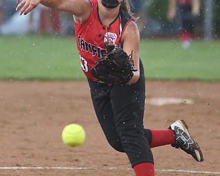 Canfield pitcher Mia Opalick(13) pitches during the 3rd inning as Canfield takes on Poland in the 12u Little League district title, Monday, July 3, 2017 at Fields of Dreams in Boardman. Poland won 7-6...(Nikos Frazier | The Vindicator)..