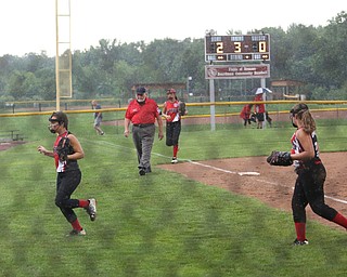 Canfield players jog off the field during a rain delay in the 3rd inning as Canfield takes on Poland in the 12u Little League district title, Monday, July 3, 2017 at Fields of Dreams in Boardman. Poland won 7-6...(Nikos Frazier | The Vindicator)..