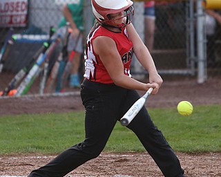 Canfield batter Bridgett Kelly(00) swings during the 4th inning as Canfield takes on Poland in the 12u Little League district title, Monday, July 3, 2017 at Fields of Dreams in Boardman. Poland won 7-6...(Nikos Frazier | The Vindicator)..