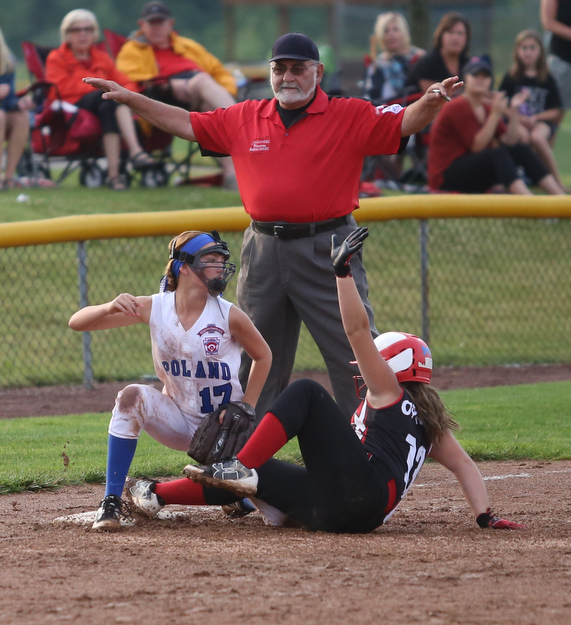 Canfield runner Mia Opalick slides into Poland third baseman Sophia D'Angelo(17) during the 4th inning as Canfield takes on Poland in the 12u Little League district title, Monday, July 3, 2017 at Fields of Dreams in Boardman. Poland won 7-6...(Nikos Frazier | The Vindicator)..