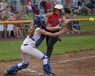 Canfield runner Bridgett Kelly(00) tries to beat out the pass to Poland catcher Emily Denney(10) during the 6th inning as Canfield takes on Poland in the 12u Little League district title, Monday, July 3, 2017 at Fields of Dreams in Boardman. Poland won 7-6...(Nikos Frazier | The Vindicator)..