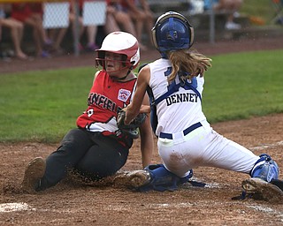 Canfield runner Bridgett Kelly(00) tries to slide past Poland catcher Emily Denney(10) during the 6th inning as Canfield takes on Poland in the 12u Little League district title, Monday, July 3, 2017 at Fields of Dreams in Boardman. Poland won 7-6...(Nikos Frazier | The Vindicator)..