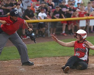 Canfield runner Bridgett Kelly(00) is called out by the home plate umpire after being tagged out by Poland catcher Emily Denney(10) during the 6th inning as Canfield takes on Poland in the 12u Little League district title, Monday, July 3, 2017 at Fields of Dreams in Boardman. Poland won 7-6...(Nikos Frazier | The Vindicator)..