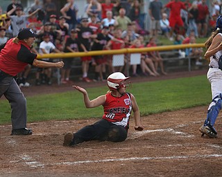 Canfield runner Bridgett Kelly(00) is called out by the home plate umpire after being tagged out by Poland catcher Emily Denney(10) during the 6th inning as Canfield takes on Poland in the 12u Little League district title, Monday, July 3, 2017 at Fields of Dreams in Boardman. Poland won 7-6...(Nikos Frazier | The Vindicator)..