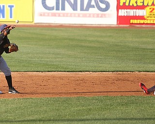 West Virginia Black Bears second baseman Raul Siri (55) throws to first as Mahoning Valley Scrappers pitcher Riley Echols (35) tries to slide into second in the first inning against the Mahoning Valley Scrappers/West Virginia Black Bears, Tuesday, July 4, 2017, at Eastwood Field in Niles...(Nikos Frazier | The Vindicator)..