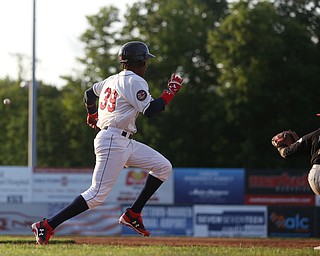 Mahoning Valley Scrappers left fielder Oscar Gonzalez (39) sprints to beat the pass to West Virginia Black Bears first baseman Jose Barraza (23) in the third inning against the Mahoning Valley Scrappers/West Virginia Black Bears, Tuesday, July 4, 2017, at Eastwood Field in Niles...(Nikos Frazier | The Vindicator)..
