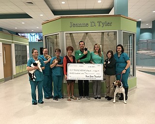 Recent graduates of Kent State Trumbull’s veterinary technology program hosted a fundraiser recently at Buffalo Wild Wings in Niles to benefit the Animal Welfare League of Trumbull County. The group raised $300 for the league. Melissa Best, program coordinator and instructor, hopes to continue raising money for the shelter and strengthening Kent State’s partnership with the AWL. From left, Tiffany Minor, adoption counselor; Bethany Cluckey, team leader; Emily Greve, adoption counselor; Dr. Kelly Johnston, KSU veterinary technology instructor; Gary Pilcher, AWL executive director; Melissa Best, KSU veterinary technology program coordinator; Karen France, education coordinator; and Tabatha Zigler, animal caretaker.