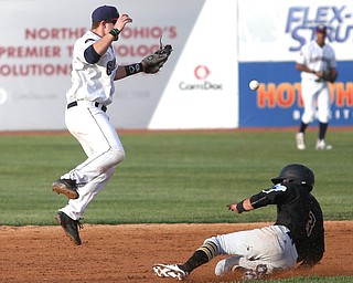 West Virginia Black Bears short stop Brett Pope (3) slides into second as Mahoning Valley Scrappers second baseman Dillon Persinger (50) jumps up but misses the ball in the third inning against the Mahoning Valley Scrappers/West Virginia Black Bears, Wednesday, July 5, 2017, at Eastwood Field in Niles. ..(Nikos Frazier | The Vindicator)..