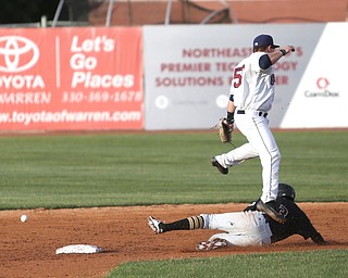West Virginia Black Bears short stop Brett Pope (3) slides into second as Mahoning Valley Scrappers second baseman Dillon Persinger (50) jumps up but misses the ball in the third inning against the Mahoning Valley Scrappers/West Virginia Black Bears, Wednesday, July 5, 2017, at Eastwood Field in Niles. ..(Nikos Frazier | The Vindicator)..