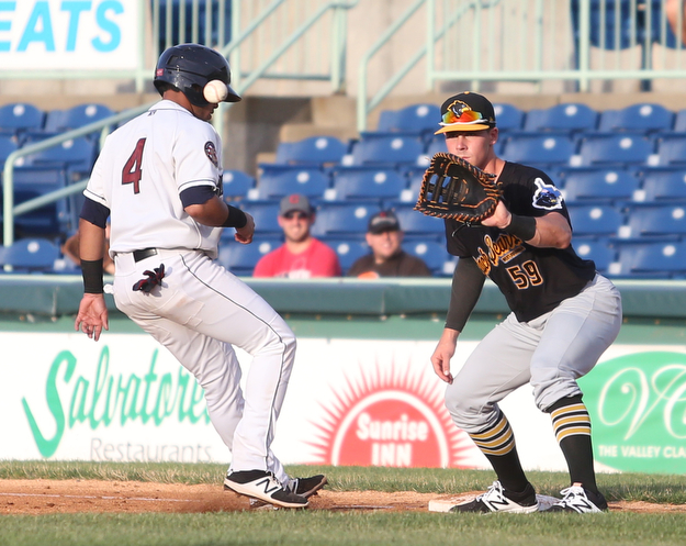 Mahoning Valley Scrappers catcher Gianpaul Gonzalez (4) steps back onto first base as West Virginia Black Bears outfielder Lucas Tancas (59) leans down for the ball in the third inning against the Mahoning Valley Scrappers/West Virginia Black Bears, Wednesday, July 5, 2017, at Eastwood Field in Niles. ..(Nikos Frazier | The Vindicator)..
