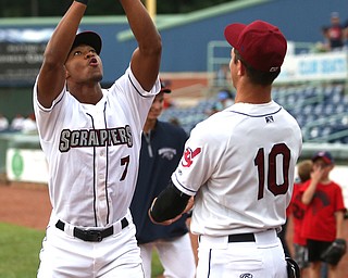 Mahoning Valley Scrappers right fielder Will Benson (7) and Mahoning Valley Scrappers third baseman Nolan Jones (10) perform their signature hand shake before the Mahoning Valley Scrappers take on the West Virginia Black Bears, Thursday, July 6, 2017, at Eastwood Field in Niles. ..(Nikos Frazier | The Vindicator)..