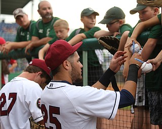 Mahoning Valley Scrappers third baseman Jonathan Laureano (25) autographs baseballs before the Mahoning Valley Scrappers take on the West Virginia Black Bears, Thursday, July 6, 2017, at Eastwood Field in Niles. ..(Nikos Frazier | The Vindicator)..