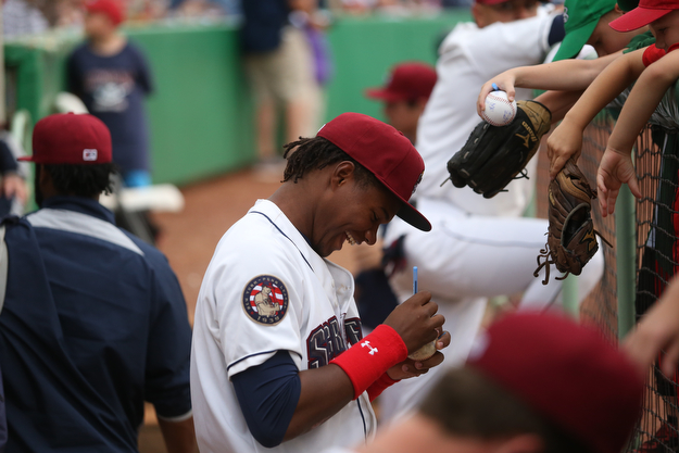 Mahoning Valley Scrappers left fielder Oscar Gonzalez (39) smiles as he autographs a baseball for a young fan before the Mahoning Valley Scrappers take on the West Virginia Black Bears, Thursday, July 6, 2017, at Eastwood Field in Niles. ..(Nikos Frazier | The Vindicator)..