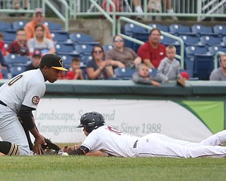 Mahoning Valley Scrappers third baseman Nolan Jones (10) slides into third as West Virginia Black Bears third baseman Julio De La Cruz (10) tries to tag him out in the first inning as the Mahoning Valley Scrappers take on the West Virginia Black Bears, Thursday, July 6, 2017, at Eastwood Field in Niles. ..(Nikos Frazier | The Vindicator)..