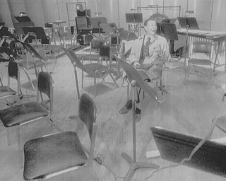 (Feb 27, 1995) John Kenley rests in chair on the stage of Powers auditorium monday afternoon while he toured the facility. Kenley is proposing to bring some shows to the area pending arrangements with the city. .. (Bruce Palmer | The Vindicator File Photo)