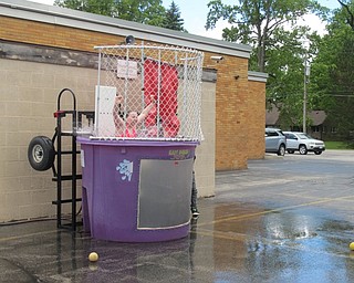 Neighbors | Alexis Bartolomucci.Lily, a fourth-grade Robinwood Lane student, fell in the dunk tank after a student hit the target during the Fun Day at school.