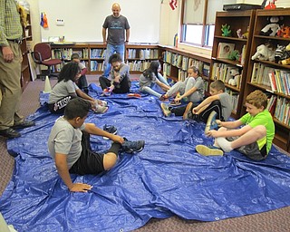 Neighbors | Alexis Bartolomucci.Fourth-grade students raced to see who could put their shoes on the fastest during the Robinwood Lane Elementary fun day.