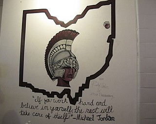 Neighbors | Alexis Bartolomucci.Two Boardman High School students, Rachel Hritz and Jessica Rauschenberg, painted one of the walls in the renovated girls locker room.