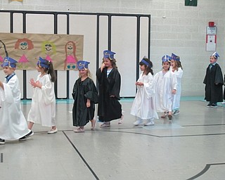 Neighbors | Alexis Bartolomucci.Samantha Cox's transitional kindergarten class walked into the gymnasium in their graduation gowns and hats on May 31.