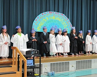 Neighbors | Alexis Bartolomucci.Students in Samantha Cox's transitional kindergarten class sang songs for their family members during graduation at Poland North Preschool.