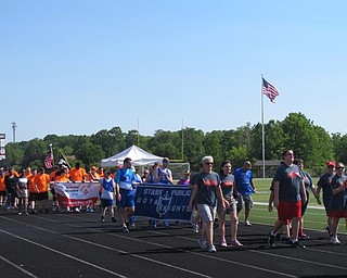 Neighbors | Alexis Bartolomucci.Coaches and athletes from different areas in Northeast Ohio walked around the track at Austintown Fitch High School before the Special Olympics began.