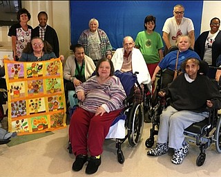 Neighbors | Submitted.Twelve painters and the activities advisors from Ashley Circle received a special recognition for their work on a painted sunflower quilt in the style of van Gogh. Pictured are, from left, (back) Anna Creque, Claudette Cook, Rose Thomae, Tami Sandford, Ron Byers and Khalilah Jordan; (middle) Bill Hegedusich, Maria Dinsio, Jennifer Robinson, John Thut, Donna Adams and Betty Kelly; (front) Barb Cappiello and Teresa Hickson.