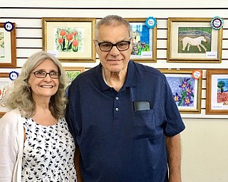 Neighbors | Submitted.Ron Byers, of Ashley Circle, won Best of Show for his painting of a prancing horse. Pictured are, from left, Kristina Rule and Ron Byers.