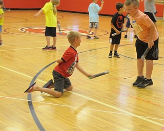 Neighbors | Alexis Bartolomucci.Students played a game using the sticks they created during Camp Invention at Austintown Intermediate School on June 19.
