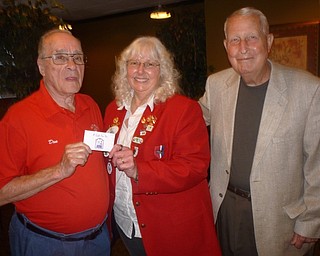 Neighbors | Submitted.Lion Don Hoelzel received the Lion of the Year award from District Governor Betty Robbins. They are pictured with Vice President Bob Melcher.