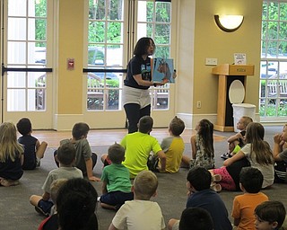 Neighbors | Alexis Bartolomucci.Mary Yee read a book to the children at the Poland library during the Captain Underpants event on June 23.