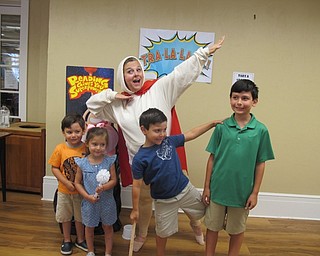 Neighbors | Alexis Bartolomucci.Captain Underpants posed with some of the children who attended the Poland library Captain Underpants program.