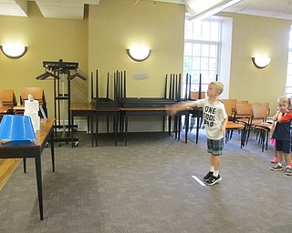 Neighbors | Alexis Bartolomucci.Children had to knock Professor Poopypants off a table by throwing a beanbag at the stack of toilet paper at the Poland library Captain Underpants program.