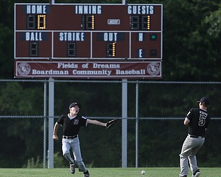 Boardman left fielder Justin Maloney (9) and Boardman short stop Jimmy Whippd (5) miss a catch in the first inning as Boardman takes on Poland, Friday, July 7, 2017, at Fields of Dreams in Boardman. Poland won 12-7...(Nikos Frazier | The Vindicator)..
