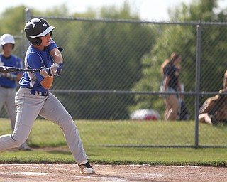 Poland first baseman Anthony Koulianos (9) swings in the second inning as Boardman takes on Poland, Friday, July 7, 2017, at Fields of Dreams in Boardman. Poland won 12-7...(Nikos Frazier | The Vindicator)..